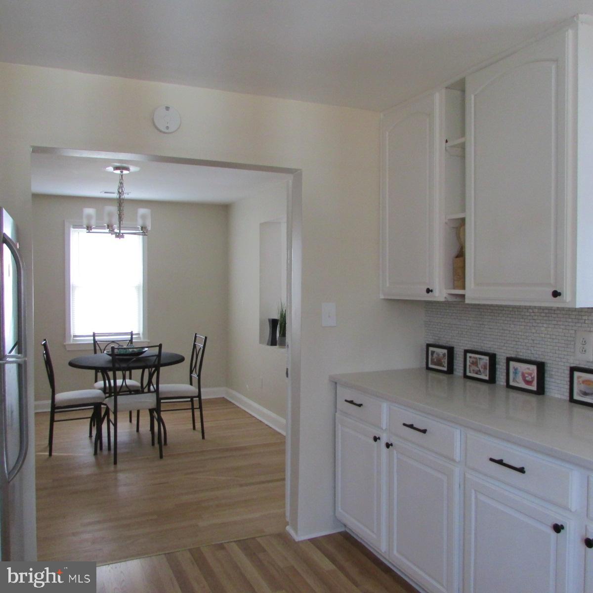 3605 Enterprise Road Bowie, MD 20721 - Photo 10 of 23 a view of a dining room with furniture and chandelier