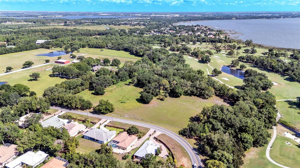 Country Club Road South Winter Haven, FL 33881 - Photo 4 of 6 an aerial view of a house with a yard