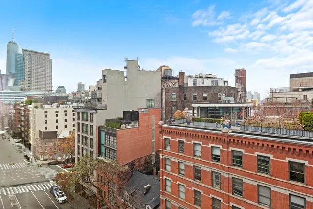 a view of a city with tall buildings