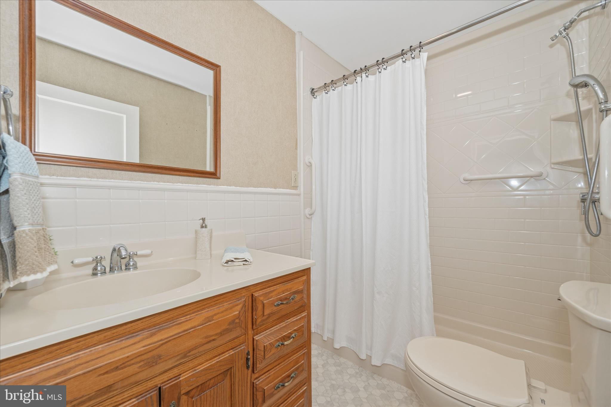 11205 Hessong Bridge Road Thurmont, MD 21788 - Photo 26 of 69 a bathroom with a sink a toilet and shower