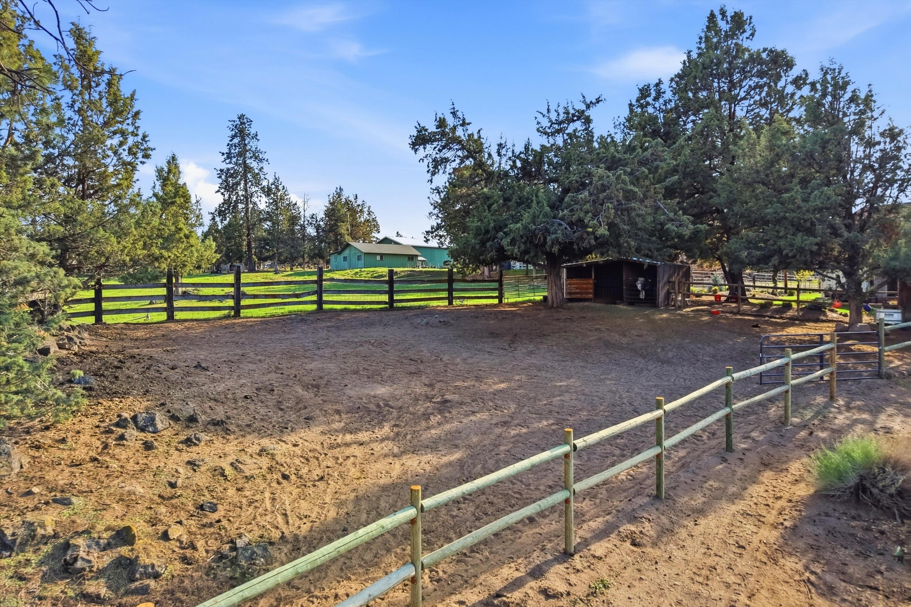 61280 Larsen Road Bend, OR 97702 - Photo 32 of 58 a view of a backyard with wooden fence