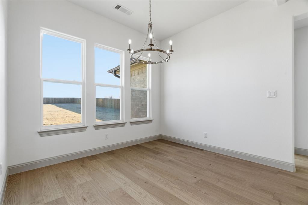 113 Rockford Street Rhome, TX 76078 - Photo 13 of 27 a view of an empty room with a window