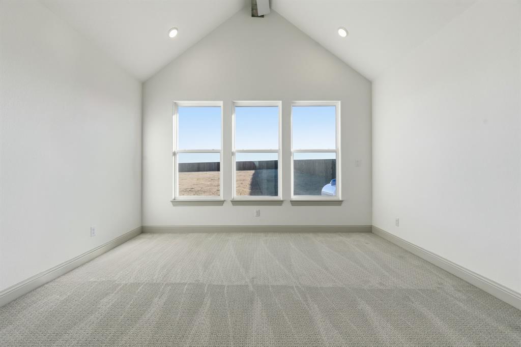 113 Rockford Street Rhome, TX 76078 - Photo 15 of 27 an empty room with a window