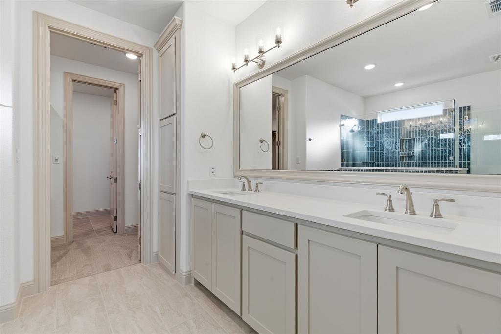 113 Rockford Street Rhome, TX 76078 - Photo 16 of 27 a bathroom with a double vanity sink mirror and double
