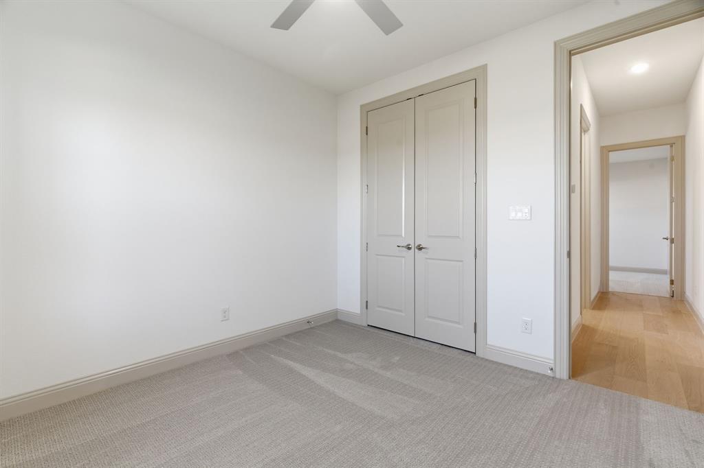 113 Rockford Street Rhome, TX 76078 - Photo 20 of 27 an empty room with closet and a chandelier fan