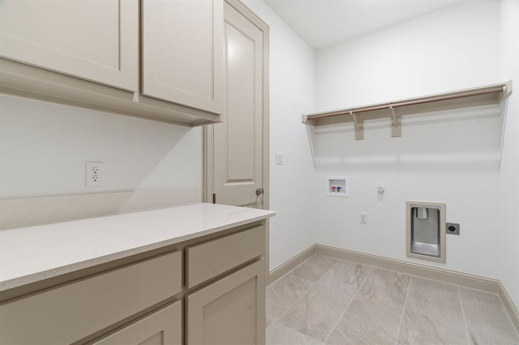 113 Rockford Street Rhome, TX 76078 - Photo 23 of 27 a room with a sink and cabinets