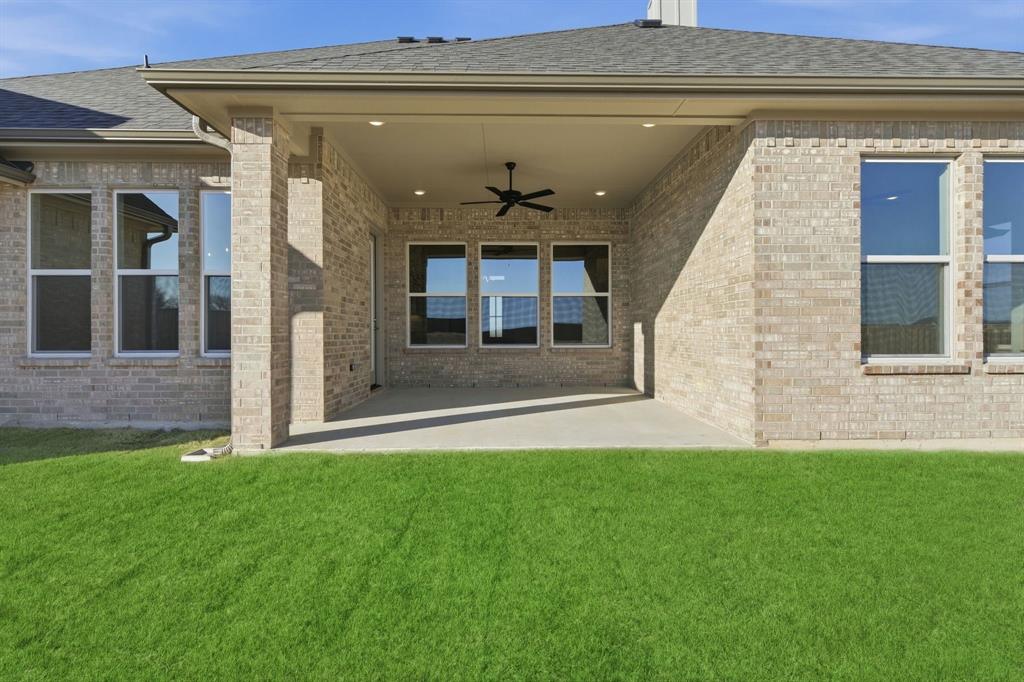 113 Rockford Street Rhome, TX 76078 - Photo 25 of 27 a front view of a house with a yard