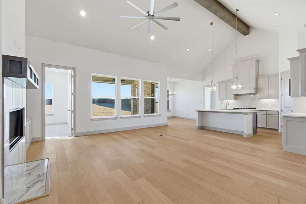 113 Rockford Street Rhome, TX 76078 - Photo 5 of 27 a view of an empty room with a kitchen