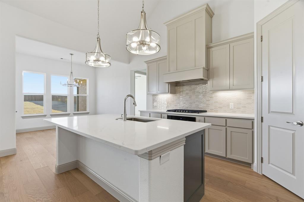 113 Rockford Street Rhome, TX 76078 - Photo 9 of 27 a kitchen that has a lot of cabinets in it