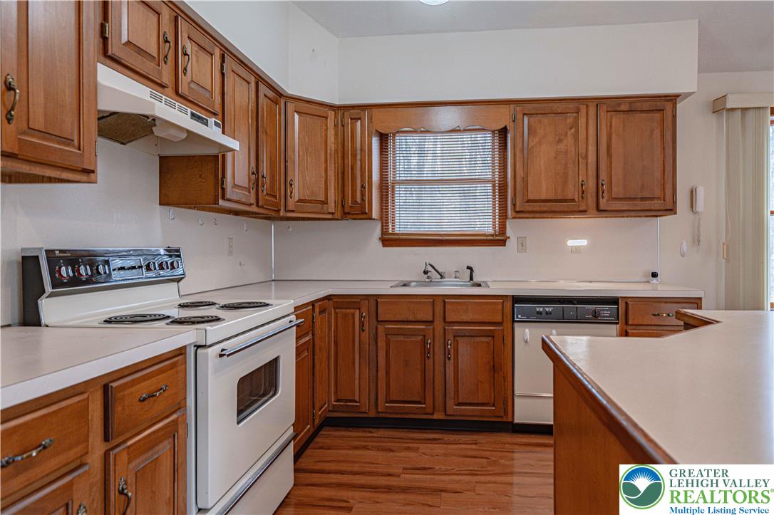 53 Panther Run Road Jim Thorpe, PA 18229 - Photo 18 of 53 a kitchen with stainless steel appliances granite countertop a stove a sink and a microwave