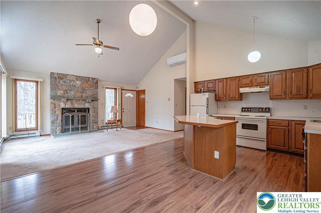53 Panther Run Road Jim Thorpe, PA 18229 - Photo 21 of 53 a kitchen with stainless steel appliances wooden floors and wooden cabinets