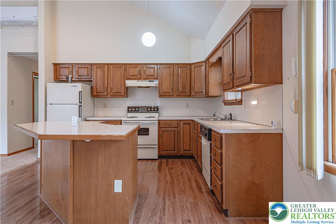 53 Panther Run Road Jim Thorpe, PA 18229 - Photo 22 of 53 a kitchen with stainless steel appliances granite countertop a stove a sink dishwasher and a refrigerator with wooden floor