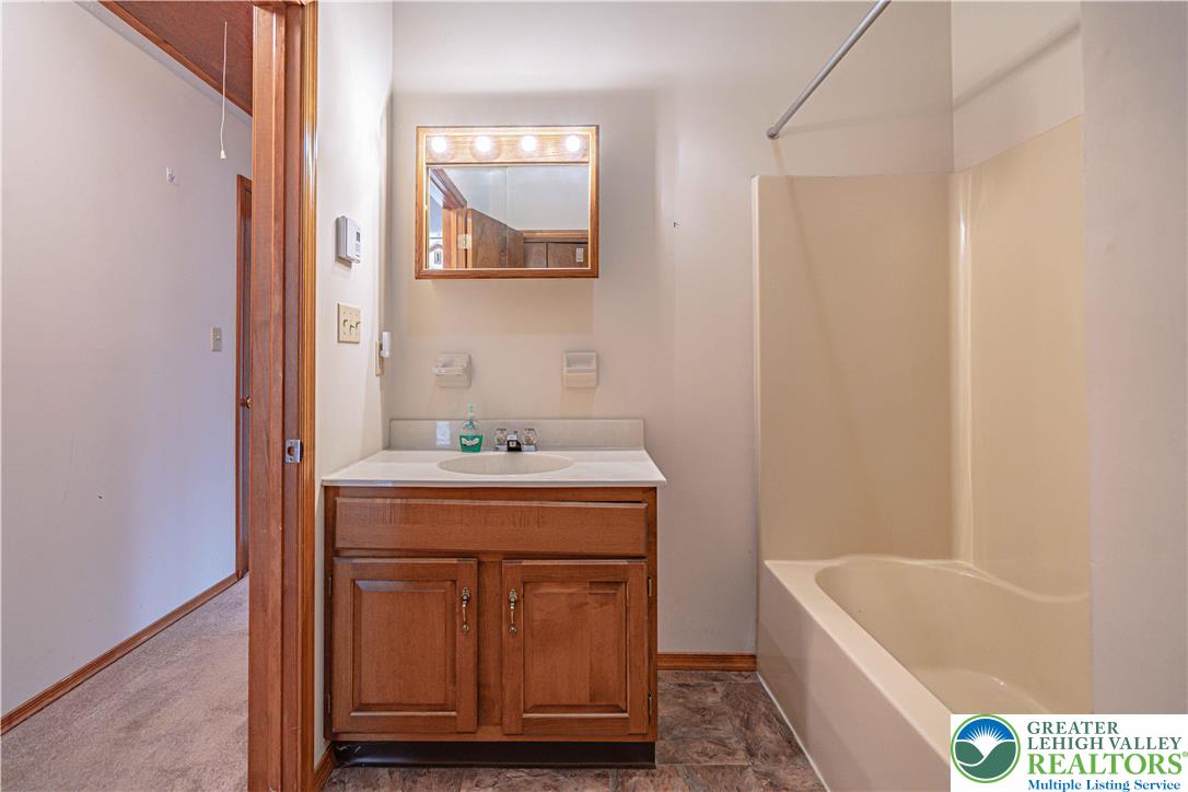53 Panther Run Road Jim Thorpe, PA 18229 - Photo 38 of 53 a bathroom with a tub sink and mirror