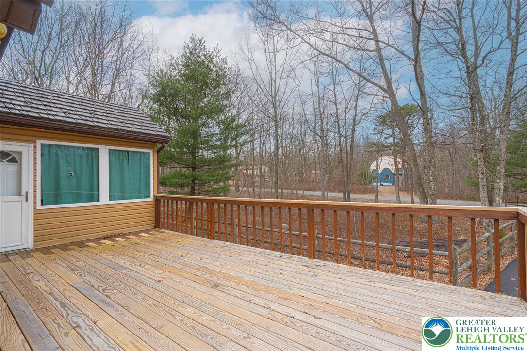 53 Panther Run Road Jim Thorpe, PA 18229 - Photo 7 of 53 a view of deck with wooden floor and fence and floor to ceiling window