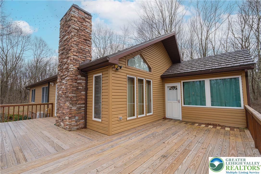 53 Panther Run Road Jim Thorpe, PA 18229 - Photo 9 of 53 a view of wooden house with a large window and wooden floor