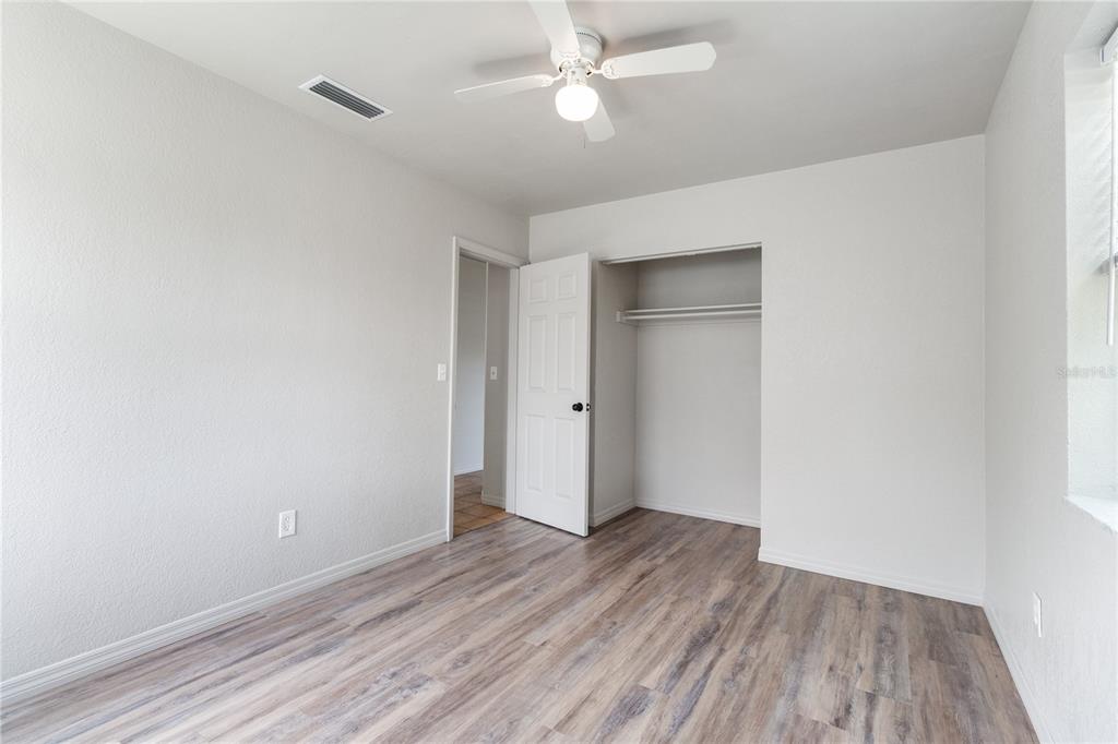 7208 Fair Oaks Street Spring Hill, FL 34606 - Photo 16 of 25 wooden floor in an empty room