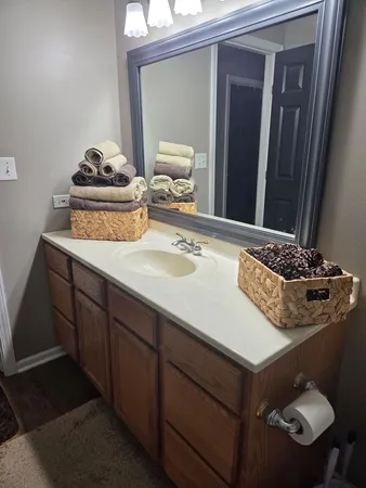 a kitchen with a sink a stove and cabinets
