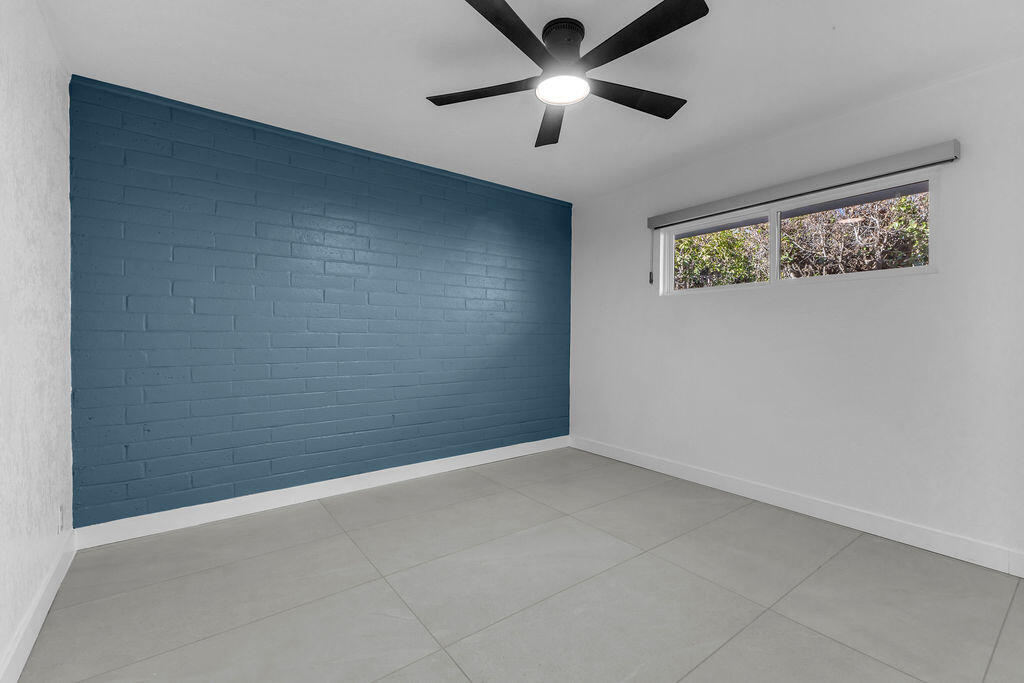 44635 San Carlos Avenue Palm Desert, CA 92260 - Photo 13 of 64 an empty room with a window and a fan
