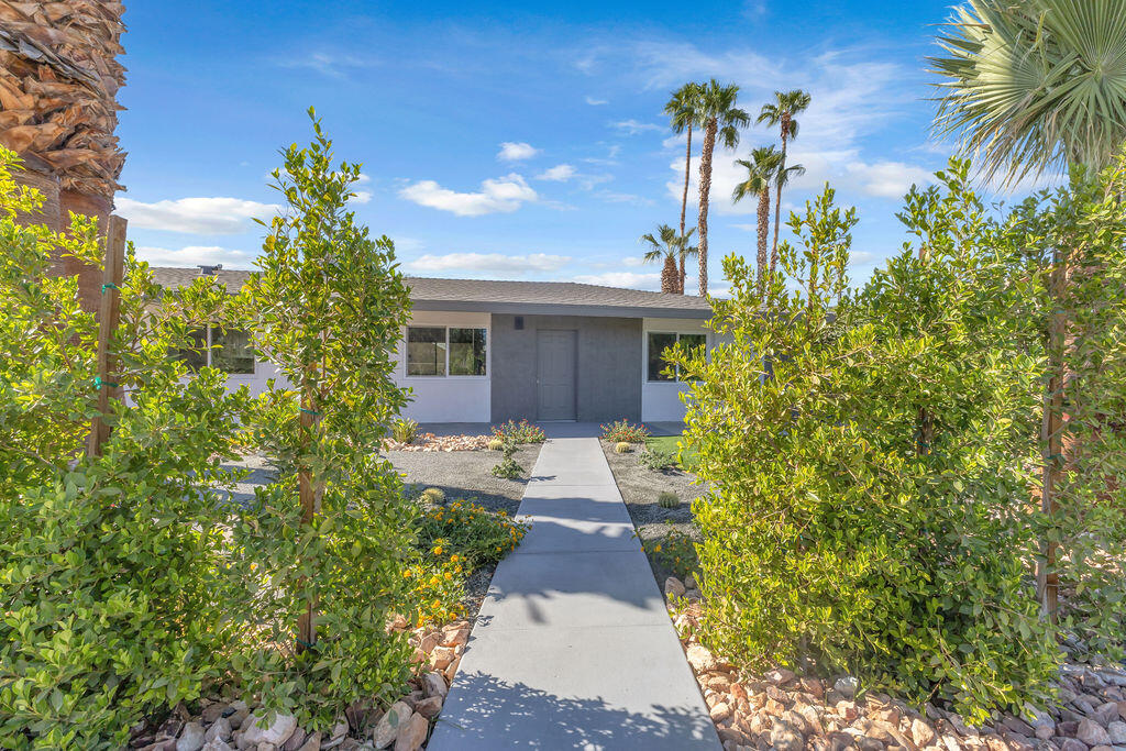44635 San Carlos Avenue Palm Desert, CA 92260 - Photo 2 of 64 a front view of a house with garden