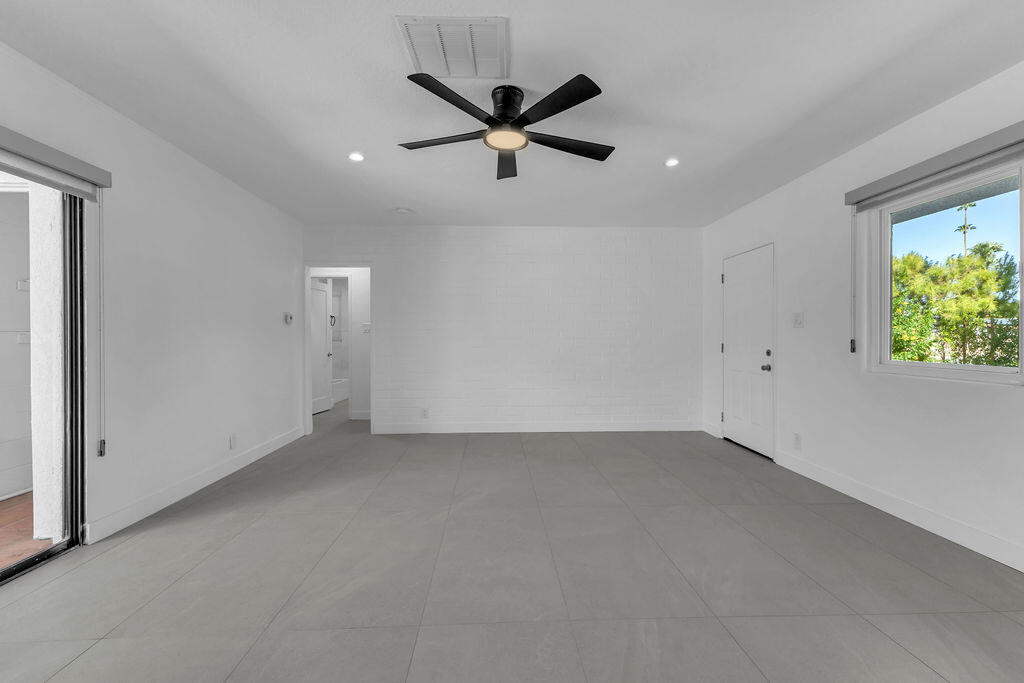 44635 San Carlos Avenue Palm Desert, CA 92260 - Photo 22 of 64 an empty room with window and ceiling fan