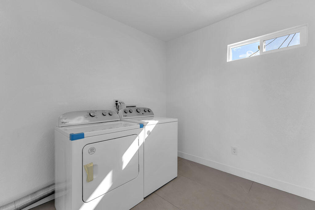 44635 San Carlos Avenue Palm Desert, CA 92260 - Photo 29 of 64 a utility room with dryer and washer