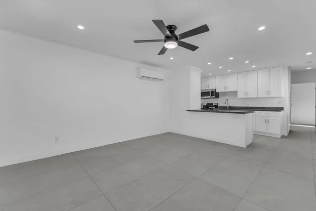 a view of a house with swimming pool and a yard