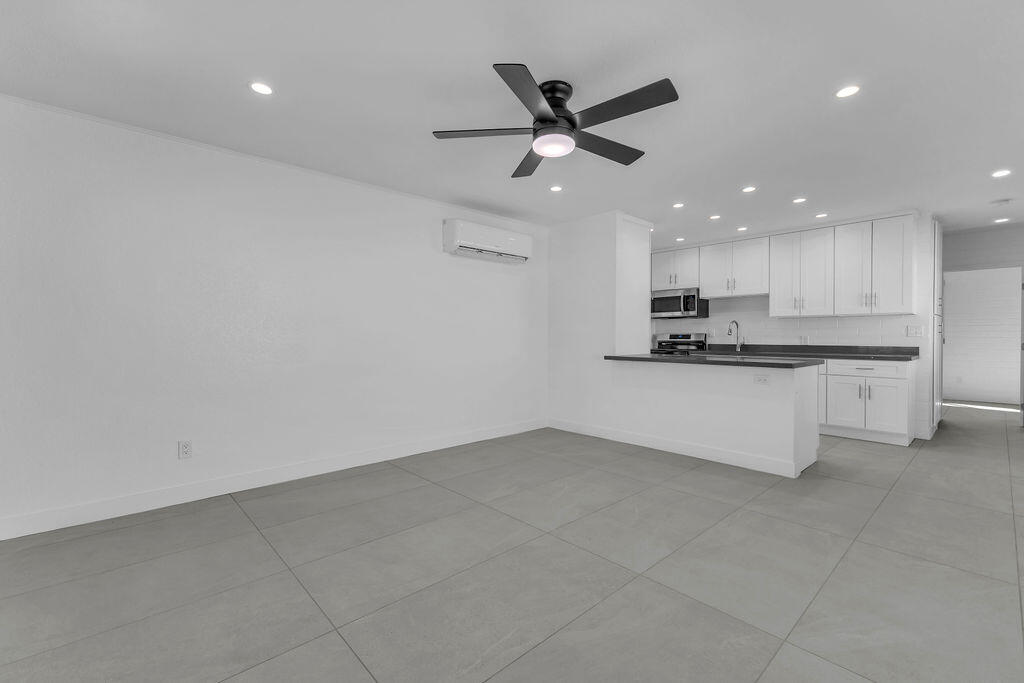 44635 San Carlos Avenue Palm Desert, CA 92260 - Photo 37 of 64 a view of a kitchen with a sink and stainless steel appliances