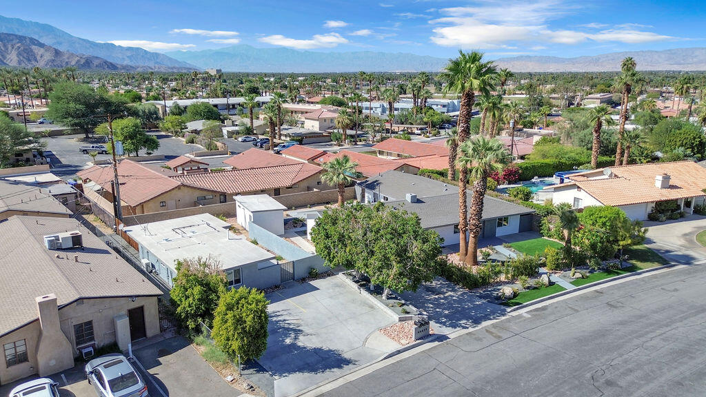 44635 San Carlos Avenue Palm Desert, CA 92260 - Photo 57 of 64 an aerial view of a city with lots of residential buildings ocean and mountain view in back