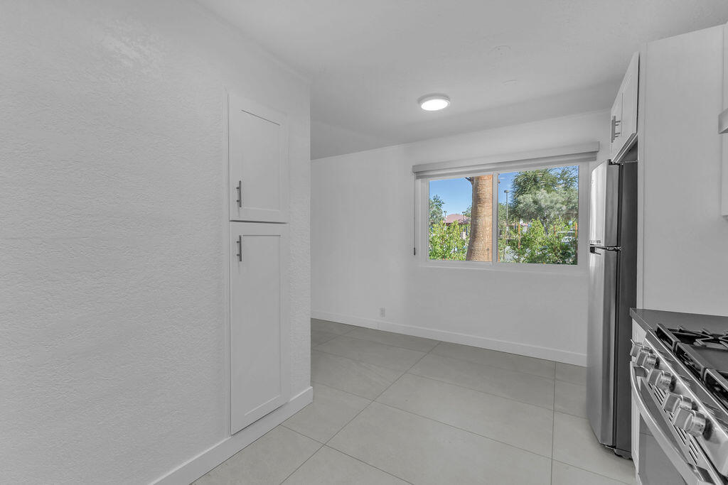 44635 San Carlos Avenue Palm Desert, CA 92260 - Photo 7 of 64 an empty room with windows