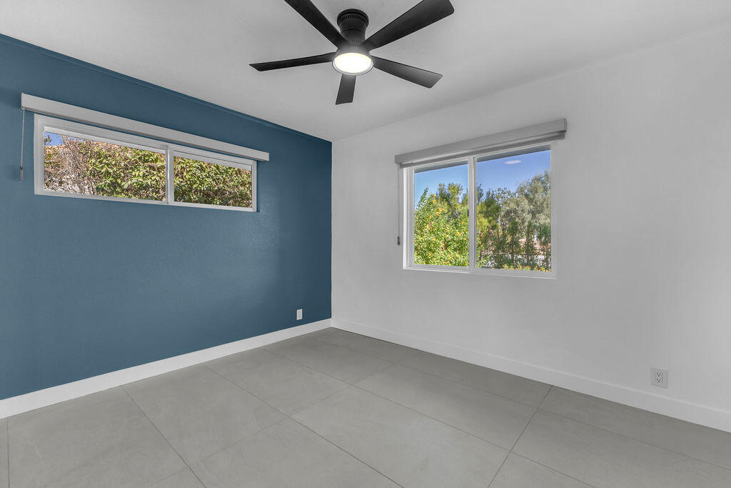 44635 San Carlos Avenue Palm Desert, CA 92260 - Photo 9 of 64 an empty room with window and ceiling fan