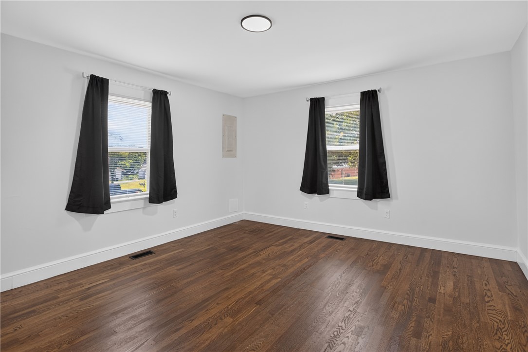 115 Pelfrey Street Seneca, SC 29672 - Photo 13 of 46 Rich hardwood floors complement neutral walls in this bright, ready-to-personalize bedroom.