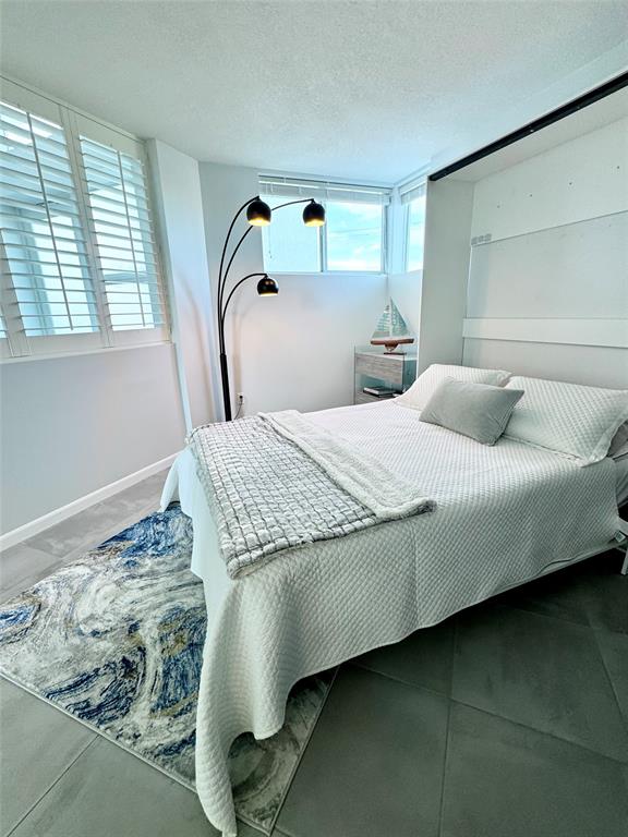 1490 Southeast 15th Street, Unit 202 Fort Lauderdale, FL 33316 - Photo 11 of 31 a bedroom with a bed and window