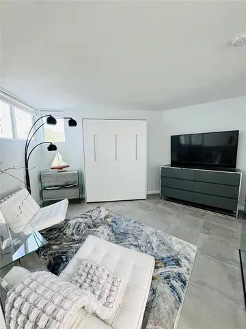 a bedroom with a bed and cabinets