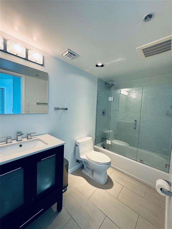 1490 Southeast 15th Street, Unit 202 Fort Lauderdale, FL 33316 - Photo 14 of 31 a bathroom with a double vanity sink toilet and shower