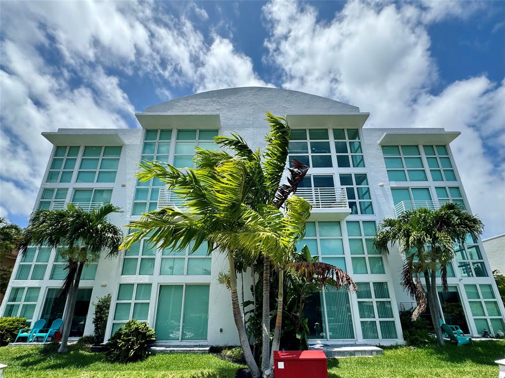 1490 Southeast 15th Street, Unit 202 Fort Lauderdale, FL 33316 - Photo 26 of 31 front view of a building and a yard