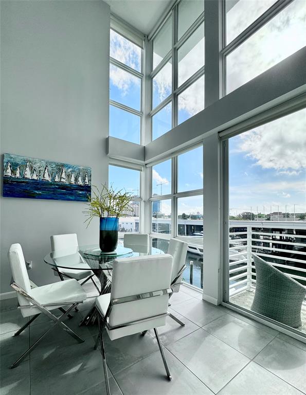 1490 Southeast 15th Street, Unit 202 Fort Lauderdale, FL 33316 - Photo 3 of 31 a view of a dining room with furniture window and outside view