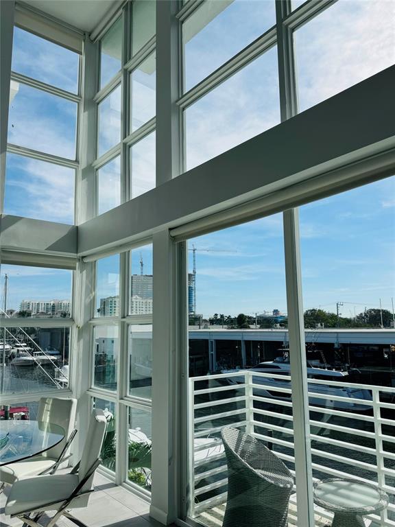 1490 Southeast 15th Street, Unit 202 Fort Lauderdale, FL 33316 - Photo 6 of 31 a view of a balcony with a chairs and iron stairs