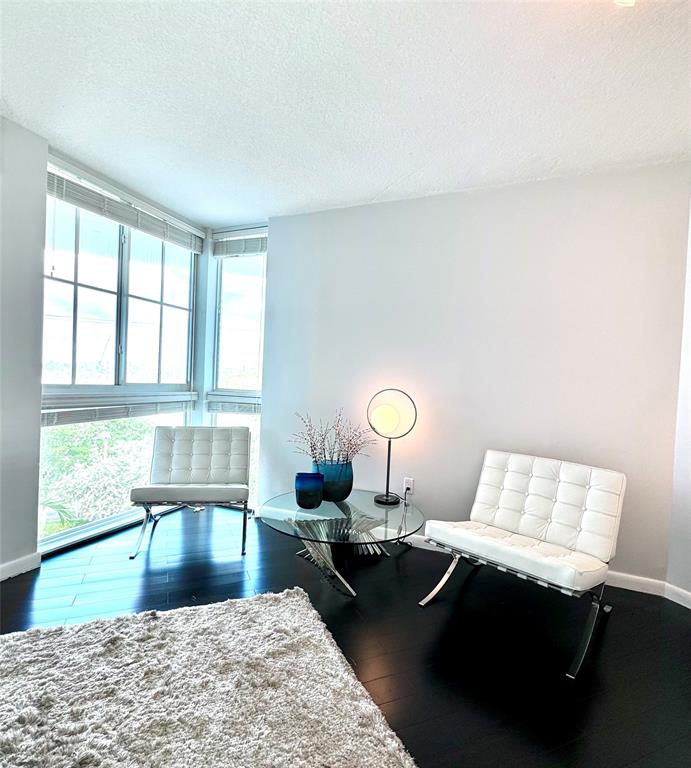 1490 Southeast 15th Street, Unit 202 Fort Lauderdale, FL 33316 - Photo 7 of 31 a living room with a couch and a large window