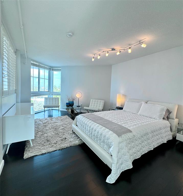 1490 Southeast 15th Street, Unit 202 Fort Lauderdale, FL 33316 - Photo 9 of 31 a bedroom with bed and window