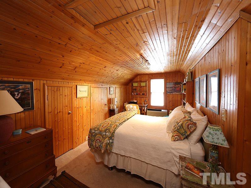 2804 Royster Street Raleigh, NC 27608 - Photo 14 of 20 a bedroom with a bed and window