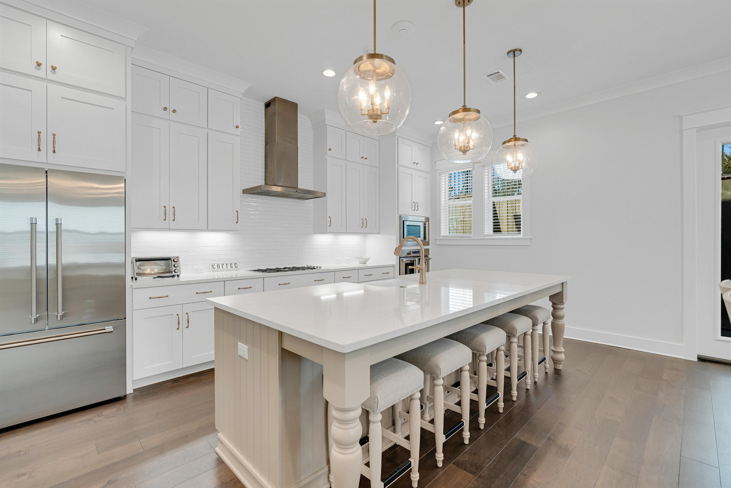 68 Ridgewalk Circle Santa Rosa Beach, FL 32459 - Photo 12 of 58 a kitchen with center island a sink stainless steel appliances and cabinets