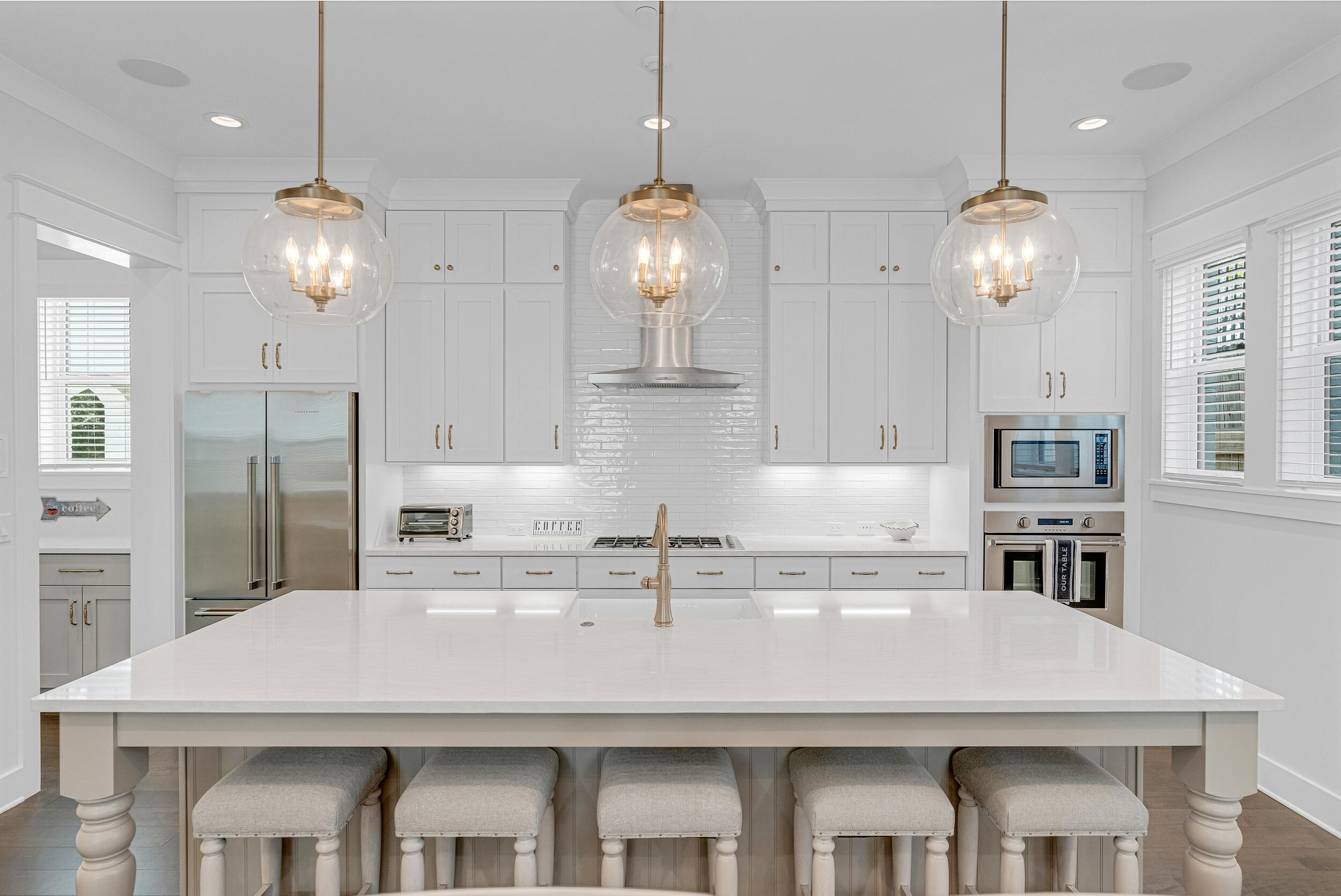 68 Ridgewalk Circle Santa Rosa Beach, FL 32459 - Photo 13 of 58 a kitchen with a dining table chairs and cabinets