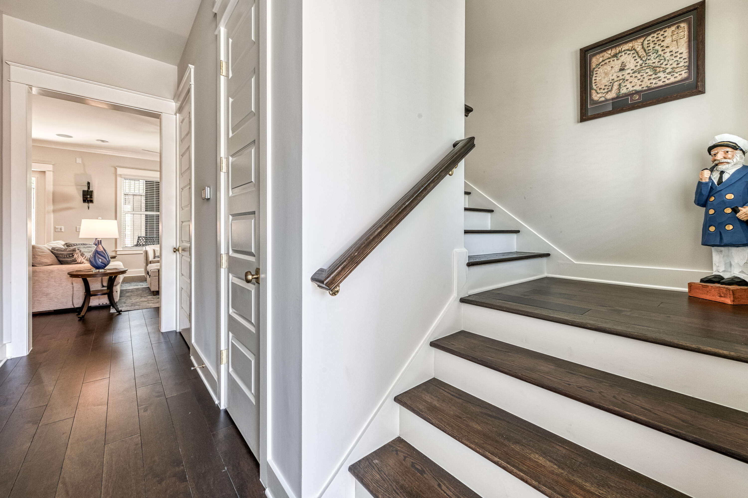68 Ridgewalk Circle Santa Rosa Beach, FL 32459 - Photo 28 of 58 a view of a hallway to a livingroom with wooden floor and stairs