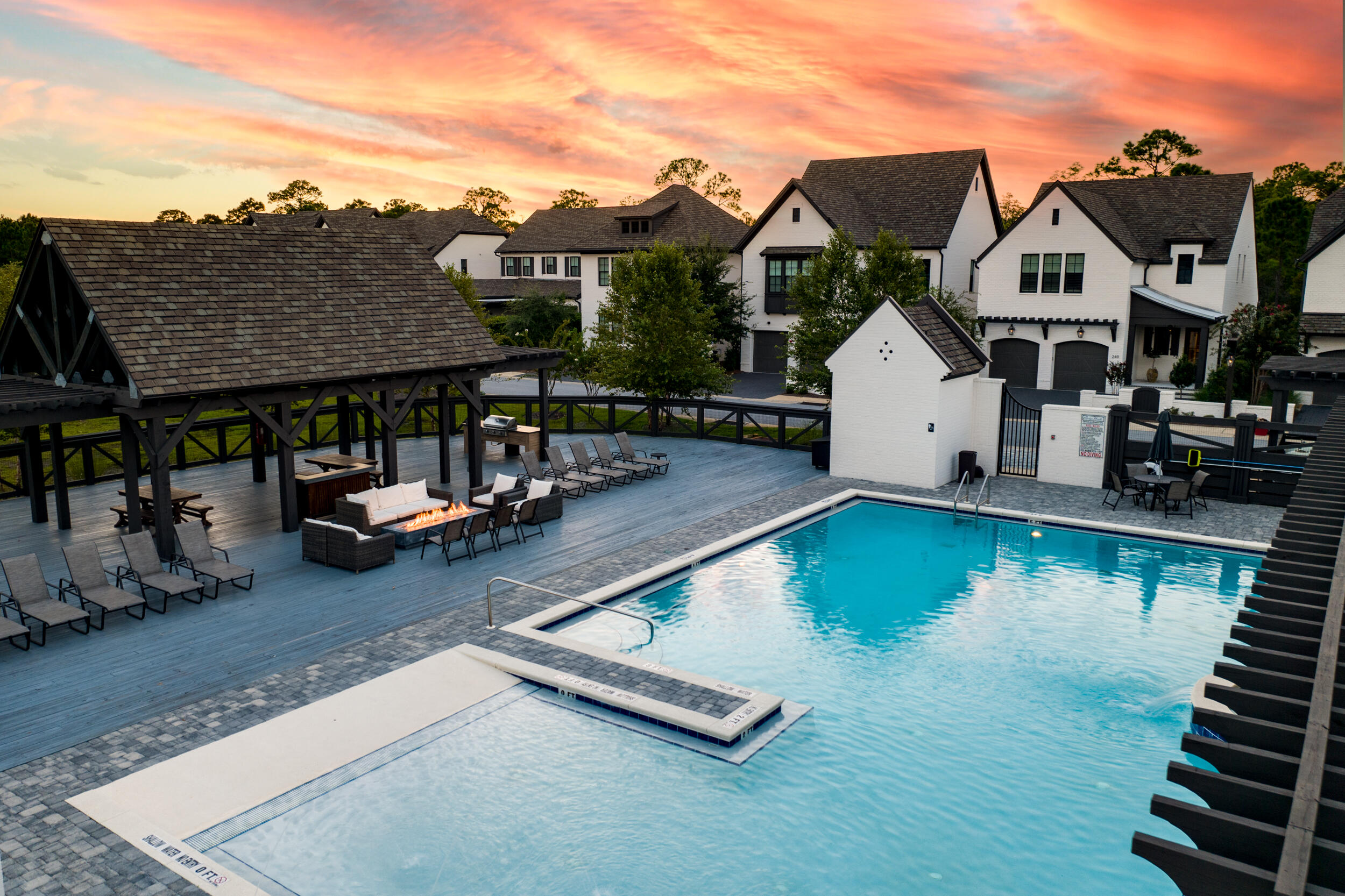 68 Ridgewalk Circle Santa Rosa Beach, FL 32459 - Photo 51 of 58 a view of a patio with table and chairs with wooden floor and fence
