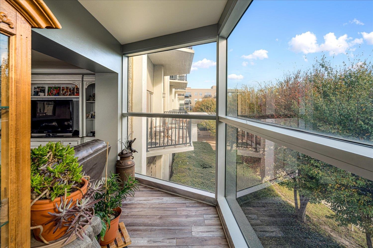 655 Riverside Drive, Unit 202 Memphis, TN 38103 - Photo 13 of 37 a view of a balcony with flower plants