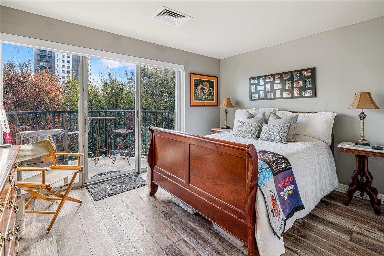 655 Riverside Drive, Unit 202 Memphis, TN 38103 - Photo 21 of 37 a bedroom with a bed and wooden floor