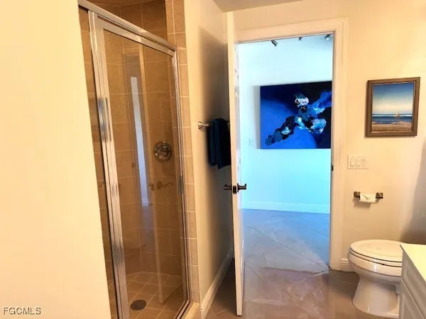 a bedroom with a bed and a mirror