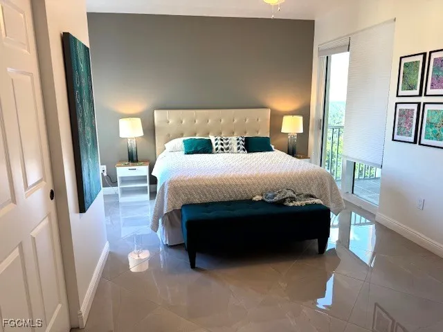 a bedroom with a bed and lamp