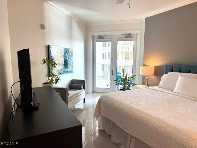 a bedroom with a bed and dresser next to a window