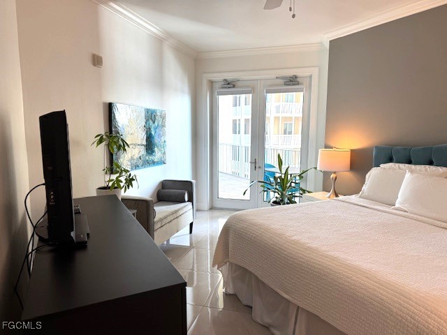 2745 First Street, Unit 1305 Fort Myers, FL 33916 - Photo 21 of 36 a bedroom with a large bed and wooden floor